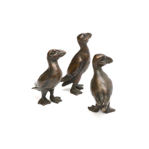 Three bronze Puffins